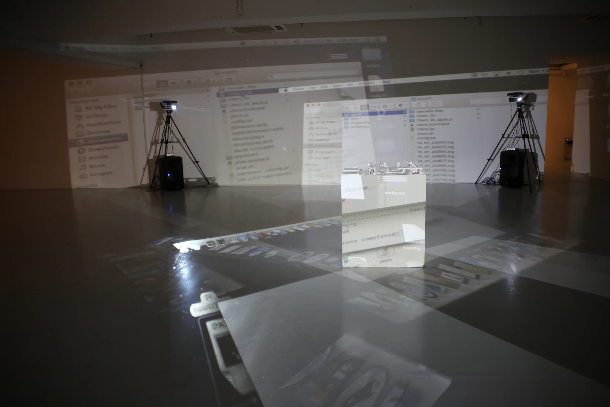 Projection equipment and a large projected computer display in the installation space.