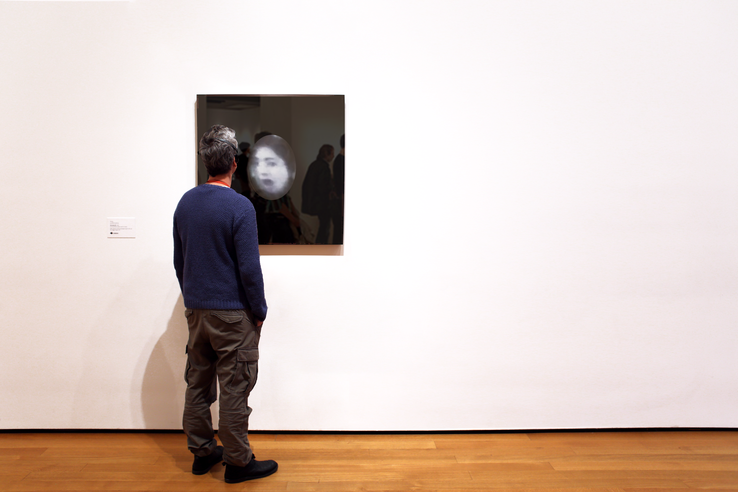 Participant facing the Walrus augmented-mirror installation.
